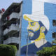 Fotografía de un edificio multifamiliar donde se observa un mural del presidente salvadoreño, Nayib Bukele, el 1 de octubre de 2023, en San Salvador (El Salvador). EFE/ Rodrigo Sura
