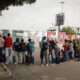 Migrantes hacen fila sobre una calle, el 19 de julio de 2024 en la ciudad de Tijuana en Baja California (México). EFE/Joebeth Terriquez
