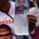 Fotografía de archivo que muestra a una persona sosteniendo una fotografía con un texto durante una marcha de madres y familiares de las víctimas de desaparición por las principales avenidas de Ciudad de México (México). EFE/Sáshenka Gutiérrez