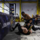 El luchador "Rey Kronos" golpea fuera del cuadrilatero a "discipulo", durante la jornada de lucha libre de Planeta de Campeones en la Ciudad de Guatemala (Guatemala). EFE/David Toro