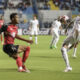 El hondureño Joseph Rosales (d) disputa un balón con el trinitense Alvin Jones este viernes en partido de la primera jornada de la Liga de Naciones de la Concacaf jugado en el estadio Nacional 'Chelato Ucles' en Tegucigalpa. EFE/ Gustavo Amador