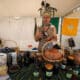 Un hombre con un traje típico de indígena Yumbo vende productos orgánicos, durante el séptimo Festival del Chocó Andino, el 12 de octubre de 2024, en la población de Calacalí, al noroccidente de Quito (Ecuador). EFE/ José Jácome