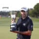 El francés Julien Guerrier posa con el trofeo que ha ganado este domingo en el Real Club de Golf Sotogrande, en el torneo Estrella Damm Andalucía Masters de golf, después de afrontar una emocionante ronda de desempate a nueve hoyos con el español Jorge Campillo EFE/A.Carrasco Ragel