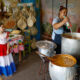 Personas preparan una sopa de vegetales, frijoles y maíz, durante la celebración del jopará, este martes en la Plaza Uruguaya, en Asunción (Paraguay). EFE/Juan Pablo Pino