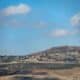 Vista de casas dañadas en la aldea de Odessa, en el sur del Líbano, en la frontera con Israel, vista desde el lado israelí de la frontera, el 15 de octubre de 2024. EFE/EPA/Atef Safadi