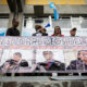 Fotografía de archivo de personas que exhiben un cartel con jueces señalados de corrupción que aspiran a formar parte de las altas cortes de Guatemala, durante una protesta el 20 de septiembre de 2024, en la Ciudad de Guatemala (Guatemala). EFE/ David Toro