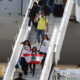 Ciudadanos brasileños residentes en el Líbano descienden del avión KC-30 de la Fuerza Aérea Brasileña este domingo en São Paulo (Brasil). EFE/ Sebastiao Moreira