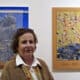 La artista palestina Vera Tamari posa junto a su obra en la exposición Pósteres de Gaza, inaugurada el 3 de noviembre de 2024 en el centro cultural Khalil Sakakini de Ramala (Cisjordania). EFE/ Alejandro Ernesto