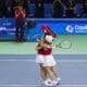 Las tenistas japonesas Shuko Aoyama y Eri Hozumi celebran la victoria de su partido contra las rumanas Monica Niculescu y Elena Gabriela perteneciente a la primera ronda de la Billie Jean King Cup, disputado este jueves en Málaga. EFE/Carlos Díaz