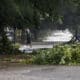 Una persona camina por una calle inundada de La Habana debido al paso del huracán Rafael. EFE/ Ernesto Mastrascusa