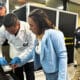 Fotografía cedida por la Policía Nacional de Colombia que muestra integrantes de la Organización Internacional de Policía Criminal (Interpol) custodiando a la ciudadana venezolana, Wanda del Valle durante su proceso de extradición este martes, a Perú en Bogotá (Colombia). EFE/ Policía Nacional de Colombia/