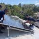 Fotografía cedida sin fecha por la Mipyme Captura, de trabajadores realizando labores de montaje de paneles solares, en La Habana (Cuba). EFE/ Captura