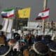 Sana'a (Yemen), 20/12/2024.- Houthi supporters wave flags (L-R) of Yemen, Iran, Hezbollah, Lebanon, Palestine and Iraq during an anti-US and anti-Israel protest in Sana'a, Yemen, 20 December 2024. Yemen's Houthis have attacked Israel with several drones, in a joint operation with Iranian-backed Iraqi militias, a day after Israel and the Houthis launched retaliatory strikes, Houthis' military spokesman Yahya Sarea said in a statement. (Protestas, Líbano, Hizbulá/Hezbolá) EFE/EPA/YAHYA ARHAB