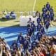 Los jugadores del Real Madrid salen al terreno de juego para participar en el entrenamiento a puerta abierta que ha tenido lugar en la Ciudad Deportiva de Valdebebas. EFE/Ballesteros