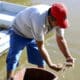 Fotografía del 17 de diciembre de 2024 de Rafael Montoya un pequeño productor trabajando en una laguna artificial donde se cultiva camarón en el municipio de Marcovia en el sur de Honduras. EFE/ Germán Reyes