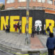 Fotografía panorámica de integrantes de colectivos artísticos pintando un grafiti este viernes en Bogotá (Colombia). EFE/ Carlos Ortega