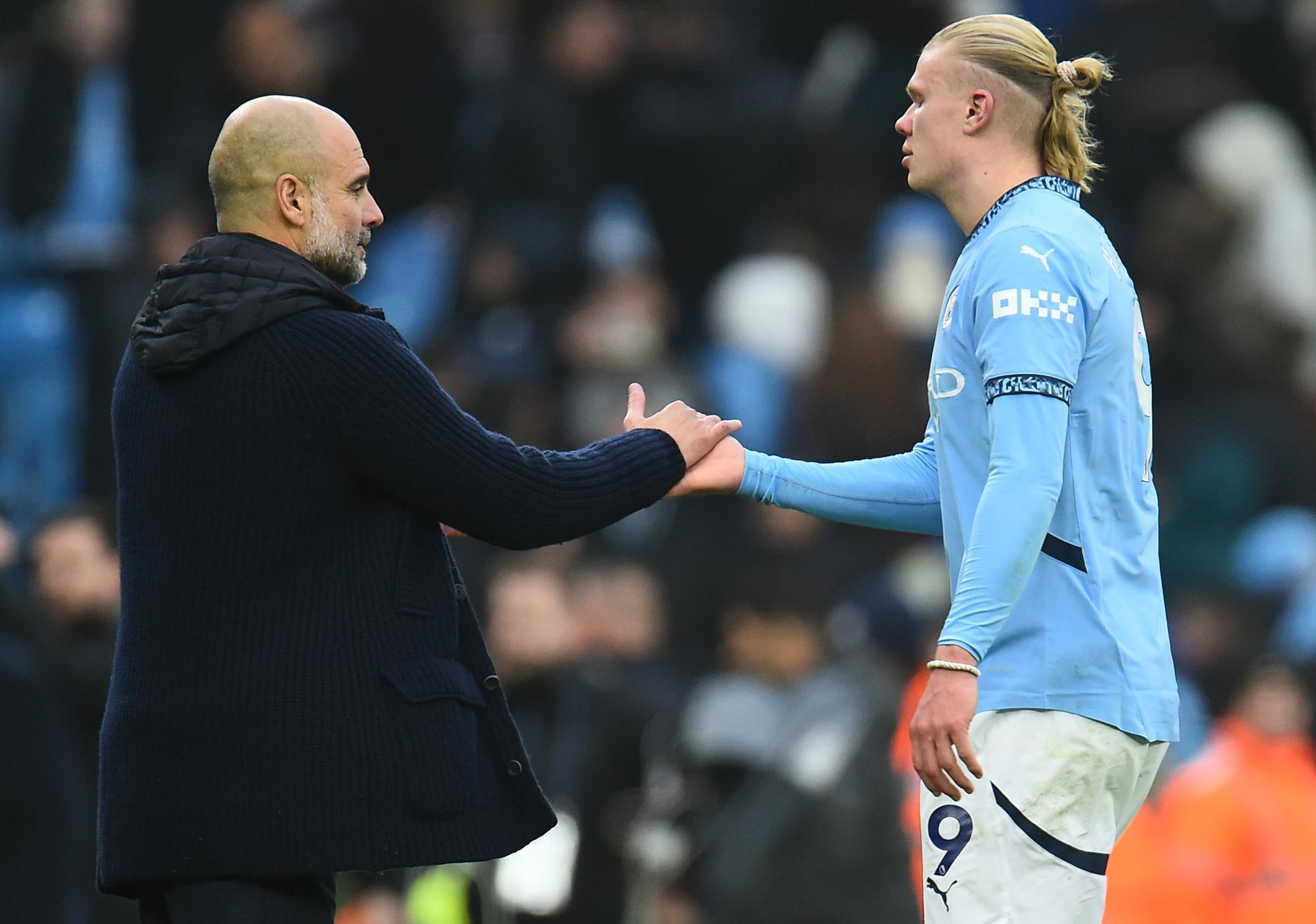 El entrenador del Manchester City Pep Guardiola y Erling Haaland. EFE/EPA/PETER POWELL