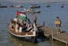 Embarcaciones de apoyo a la causa palestina navegan este sábado en la laguna costera española de la Albufera. EFE/ Kai Foersterling