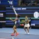 Las italianas Sara Errani y Jasmine Paolini en acción contra Miyu Kato de Japón y Fanny Stollar de Hungría durante la final del partido de dobles femeninos en el Abierto de China, en Pekin. EFE/EPA/ANDRES MARTINEZ CASARES