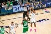 Santi Aldama (d) lanza a canasta ante la oposición de Xavier Tillman, de Celtics, en el partido disputado en el FedExForum, en Memphis (Estados Unidos). EFE/ Matthew A. Smith