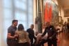 MADRID, 12/10/2025.- Dos activistas del movimiento de desobediencia civil no violenta Futuro Vegetal han lanzado este domingo pintura roja biodegradable sobre un cuadro en el Museo Naval de Madrid, en un acto de protesta por la celebración de la Fiesta Nacional y para denunciar el actual neocolonialismo extractivista que explota sus recursos naturales. EFE/ Gaspar Ruiz-canela
