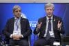 El ministro de Economía argentino, Luis Caputo (i), y el presidente del Banco Central de Argentina, Santiago Bausili, hablan durante un evento en el Atlantic Council este miércoles, en Washington (Estados Unidos). EFE/ Lenin Nolly