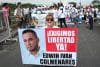 Familiares de ciudadanos colombianos detenidos en Venezuela sostienen carteles en una protesta para exigir su libertad este sábado, en el puente internacional Simón Bolívar en La Parada (Colombia). EFE/ Mario Caicedo
