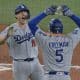 El jugador Will Smith (i) celebra con Freddie Freeman (d) tras conectar un jonrón solitario para allanar el título por segundo año consecutivo de los Dodgers de Los Angeles en la Serie Mundial decidida sobre los Azulejos este sábado en Toronto. EFE/EPA/EDUARDO LIMA