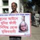 Dhaka (Bangladesh), 17/11/2025.- A person holds a placard featuring the face of former Banladeshi Prime Minister Sheikh Hasina in front of the International Crimes Tribunal (ICT), in the high court area in Dhaka, Banladesh, 17 November 2025. The International Crimes Tribunal-1 will deliver the verdict in the case against deposed prime minister Sheikh Hasina and two of her top aides. Sheikh Hasina faces charges of crimes against humanity, including murder, related to the July 2024 uprising. EFE/EPA/MONIRUL ALAM