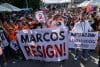 QUEZON CITY (Philippines), 16/11/2025.- Protesters hold signs calling for the resignation of Philippine President Ferdinand 'Bongbong' Marcos Jr., during an anti-corruption rally in Quezon City, Metro Manila, Philippines, 16 November 2025. Ongoing investigations into government infrastructure programs, including flood control projects, have led various cause-oriented groups to hold mass demonstrations against corruption allegedly committed by low-level officials up to the highest ranked leaders in the country. (Protestas, Filipinas) EFE/EPA/ROLEX DELA PENA