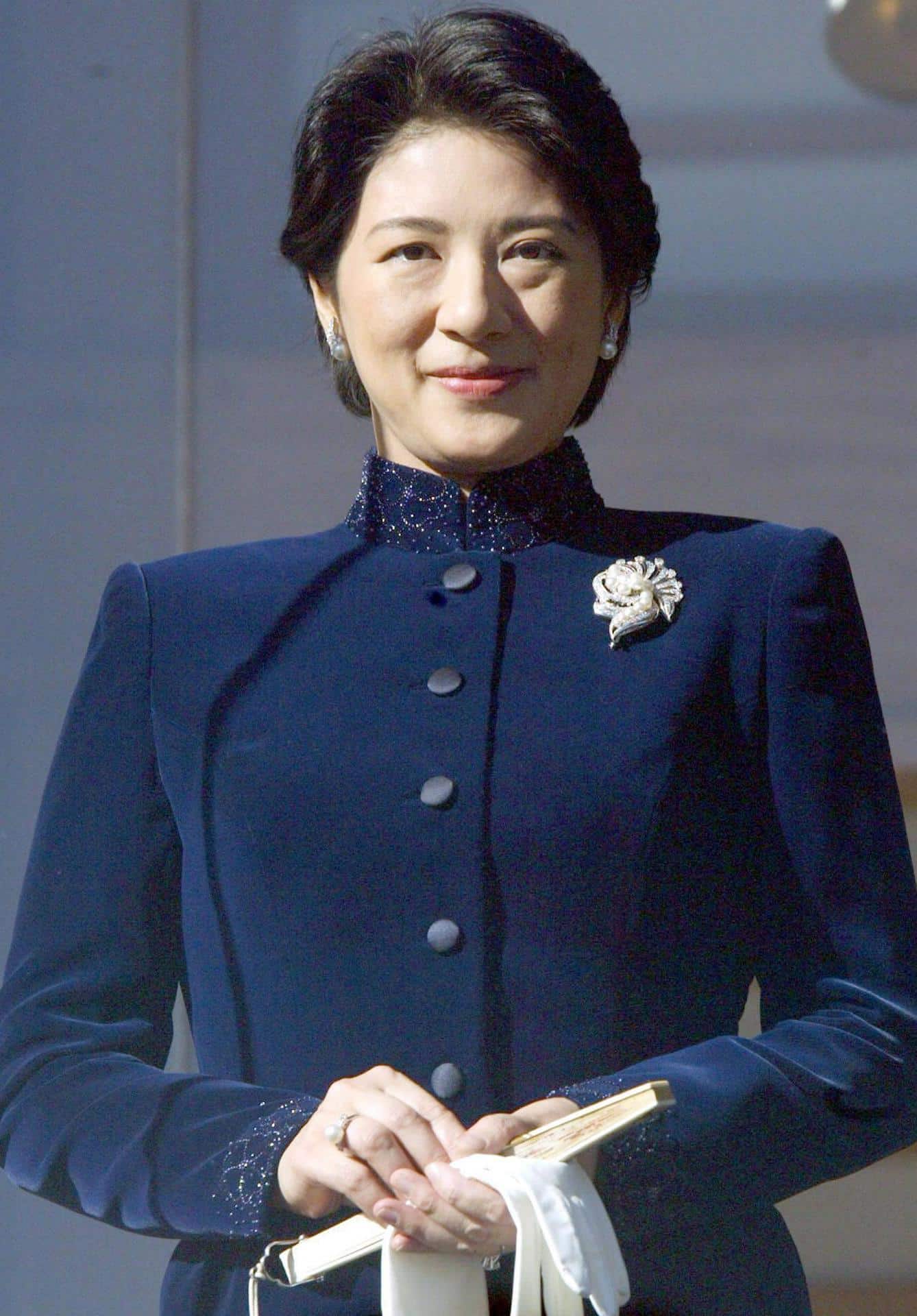 Archive - epa000339219 Japan's Crown Princess Masako waves from a glass-enclosed balcony at the Imperial Palace in Tokyo, Sunday 02 January 2005. Masako joined the rest of the imperial family in greeting the public at the start of this year after missing the annual ritual last year to recover from a psychological disorder brought on by the stresses of royal life. It is her first apparition at a public event since 13 months. EPA/FRANCK ROBICHON STR