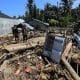 MEURUDU (Indonesia), 01/12/2025.- Residents walk among large piles of wood that were swept away by the floodwaters in a flood-affected village in the Meureudu area, Pidie Jaya Aceh, Indonesia, 01 December 2025. According to National Disaster Management Agency Floods and landslides triggered by Tropical Cyclone Senyar have killed at least 442 people across Aceh, North Sumatra, and West Sumatra provinces. This number is expected to rise, as approximately 402 people remain uncounted for. (Inundaciones) EFE/EPA/HOTLI SIMANJUNTAK