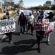 Personas sostienen carteles durante una protesta este sábado, en Ciudad de México (México). EFE/ José Méndez
