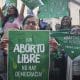 Mujeres sostienen carteles y pañuelos este sábado, durante una manifestación que conmemora los 4 años del aborto legal en Bogotá (Colombia). EFE/ Martina Castells