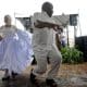 Bailarines de bomba bailan en la celebración del centenario del compositor puertorriqueño Catalino 'Tite' Curet Alonso este jueves, en el cementerio Santa María de Pazzis en San Juan (Puerto Rico). EFE/ Thais llorca
