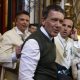 MÁLAGA, 29/03/2026.- El actor malagueño Antonio Banderas junto a los nazarenos de la Cofradía de María Santísima de Lágrimas, a su llegada a la iglesia de San Juan de Málaga, para procesionar hoy Domingo de Ramos. EFE/Jorge Zapata