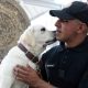 Un integrante de la Guardia Nacional posa junto a un perro del 'Escuadrón Canino' este lunes, en el Aeropuerto Internacional Felipe Ángeles (AIFA) en Santa Lucía (México). EFE/Mario Guzmán