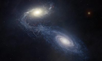 Una representación artística muestra la gigantesca galaxia espiral NGC 1365 en el momento en que choca y se fusiona con una galaxia compañera más pequeña, lo que estimula la formación estelar y redistribuye el gas y los elementos pesados. Fotografía cedida por Melissa Weiss/CfA