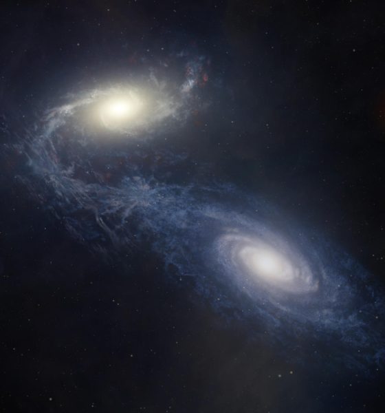 Una representación artística muestra la gigantesca galaxia espiral NGC 1365 en el momento en que choca y se fusiona con una galaxia compañera más pequeña, lo que estimula la formación estelar y redistribuye el gas y los elementos pesados. Fotografía cedida por Melissa Weiss/CfA