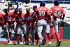 Jugadores de Cuba celebran este viernes la victoria por 3-1 sobre Cuba en partido de la primera jornada del Grupo A del VI Clásico Mundial de Béisbol jugado en el estadio Hiram Bithorn de San Juan. EFE/ Thais Llorca
