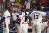 Jugadores de República Dominicana celebran la victoria maciza sobre Nicaragua en el primera partido de ambos países correspondiente al Grupo D del Clásico Mundial de Béisbol en el LoanDepot de Miami EFE/ Alberto Boal
