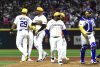 Jugadores de la novena de Colombia reaccionan con desconsuelo a la derrota por 5-0 ante la de Puerto Rico en partido de la primera jornada del Clásico Mundial de Béisbol jugado este viernes en el estadio Hiram Bithorn de San Juan. EFE/ Thais Llorca
