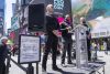 Personas participan en el performance de la artista cubana Tania Bruguera, "El susurro de Tatlin #6", en el que invita a cualquiera a subir a un estrado, tomar un micrófono y hablar libre de censura durante un minuto en la plaza de Times Square este 1 de mayo de 2026, en Nueva York (EE. UU.). EFE/ Ángel Colmenares

