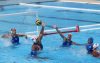 La venezolana Beatriz Escobar (c-i) disputa el balón con la cubana Alejandra Aranguren (c-abajo) en un partido rumbo a la final de Polo Acuático de los XXV Juegos Centroamericanos y del Caribe. EFE/Orlando Barría

