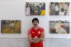 El artista ecuatoriano CMAL, posa junto a su obra 'La mirada de mi madre', en la muestra titulada 'Los de aquí', en la que participan nueve artistas de Ecuador que hacen dialogar el arte contemporáneo con los movimientos migratorios, en Cartagena (España), con motivo del Festival Mar de Músicas, este año dedicado a Ecuador. EFE/Marcial Guillén