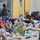 Cientos de inmigrantes marroquíes descansan en las calles de Ceuta, este lunes. La vigilancia en el entorno de la frontera del Tarajal, tanto por vía marítima como terrestre, así como los nuevos medios de contención en la zona con la instalación de una barrera en el mar han reducido al mínimo las entradas a nado desde Marruecos. EFE/Reduan
